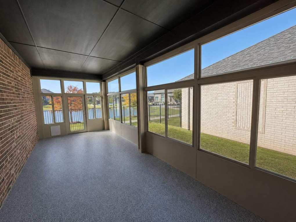 Coated floor in the Lakeside sunroom, lake beyond the glass